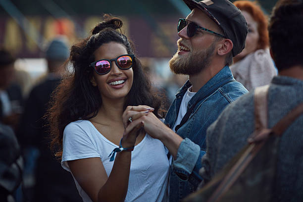 couple dancing at concert outside - concert stock pictures, royalty-free photos & images