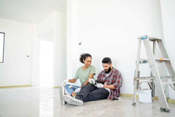 couple doing a repair in new home and relaxing,renovation,repair and family concept. - home decoration stock pictures, royalty-free photos & images