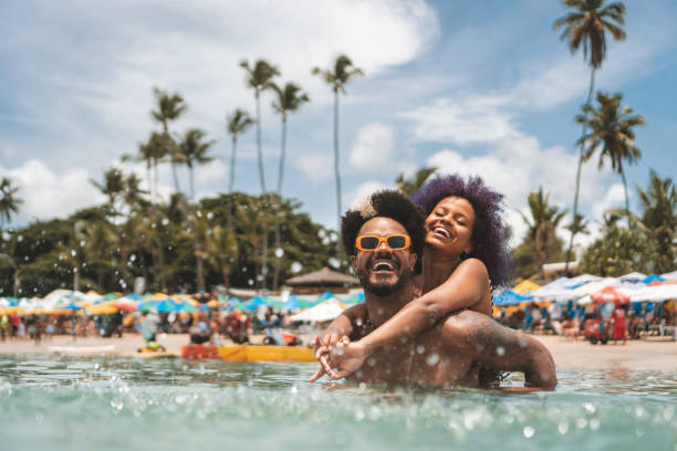 couple having fun at porto de galinhas beach - travel stock pictures, royalty-free photos & images