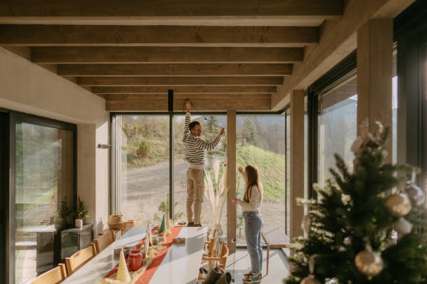 couple is decorating the house - home decoration stock pictures, royalty-free photos & images
