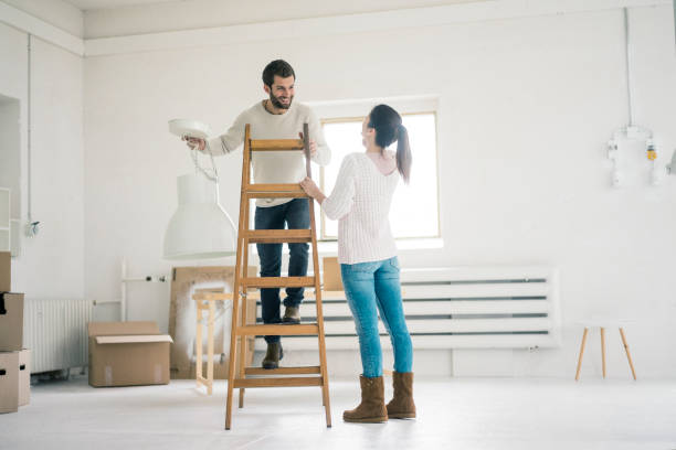 couple moving into new home - home decoration stock pictures, royalty-free photos & images