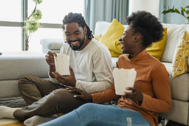 couple ordered pasta to eat at home - junk food stock pictures, royalty-free photos & images