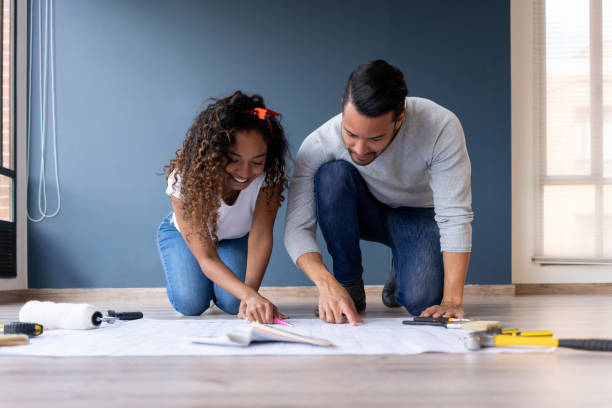 couple redecorating their house - home decoration stock pictures, royalty-free photos & images
