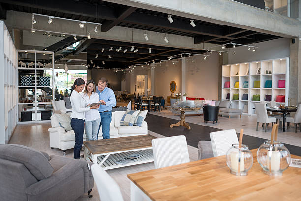 couple shopping at a furniture store - home decoration stock pictures, royalty-free photos & images