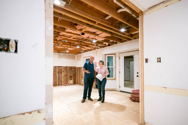 couple supervising home renovation progress - home decoration stock pictures, royalty-free photos & images