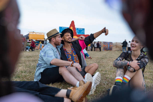 couple taking a selfie at festival - concert stock pictures, royalty-free photos & images