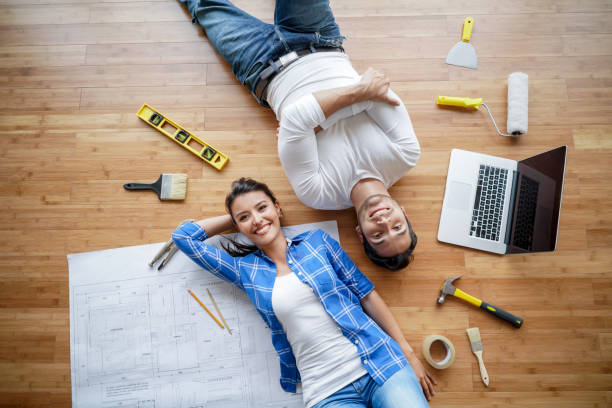 couple working on a housing project - home decoration stock pictures, royalty-free photos & images