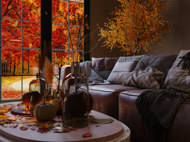 cozy autumn living room with brown leather sofa with pillows and blankets, stone coffee table with autumn flowers, pumpkins and lighted candles. autumn mood. - home decoration stock pictures, royalty-free photos & images