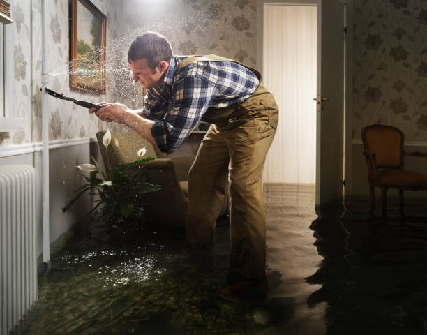craftsman fixing pipe in flooded room - home decoration stock pictures, royalty-free photos & images