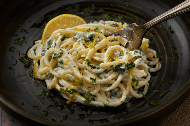 creamy ricotta, lemon and spinach spaghetti - food stock pictures, royalty-free photos & images