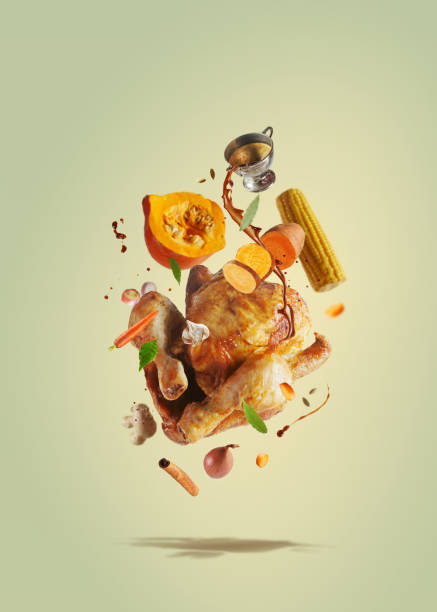 creative thanksgiving food with pouring sauce on flying roasted whole turkey, pumpkin, sweet potato, corn and carrots flying in the air - food stock pictures, royalty-free photos & images
