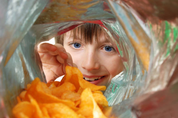 crisp monster - junk food stock pictures, royalty-free photos & images