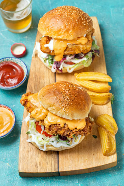 crispy fried chicken burger - junk food stock pictures, royalty-free photos & images