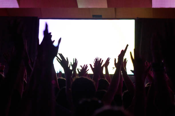 crowd silhouette at a performance - concert stock pictures, royalty-free photos & images