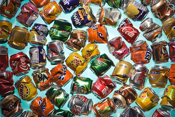 crushed aluminum cans - junk food stock pictures, royalty-free photos & images
