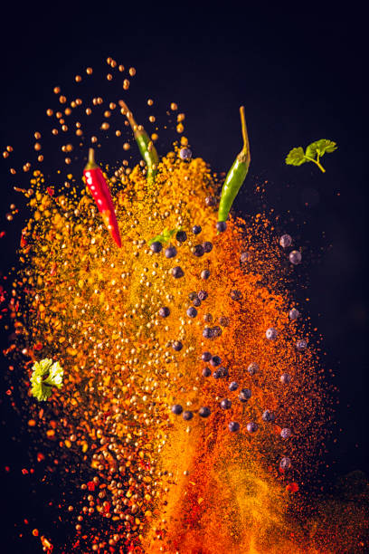 curry spice mix food explosion - food stock pictures, royalty-free photos & images