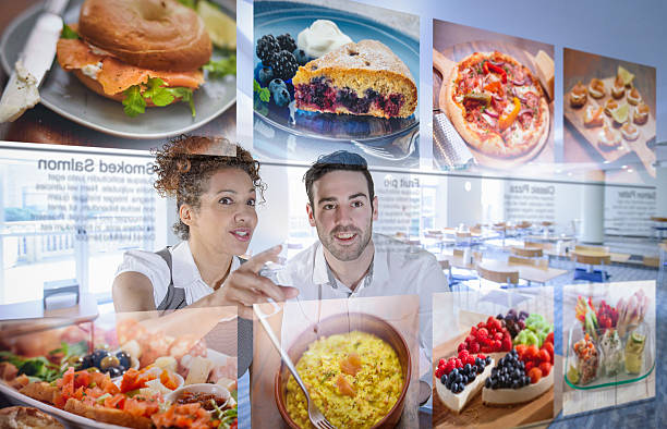 customers choosing food from interactive display in office canteen - food photos et images de collection