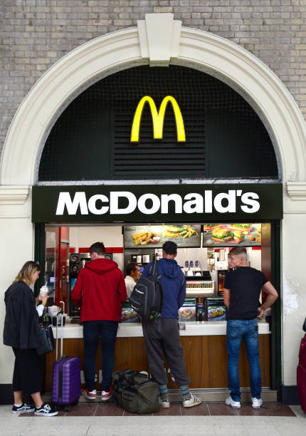 Customers purchase lunch at a McDonald's fast food restaurant located in London Victoria train and underground station in London, England.