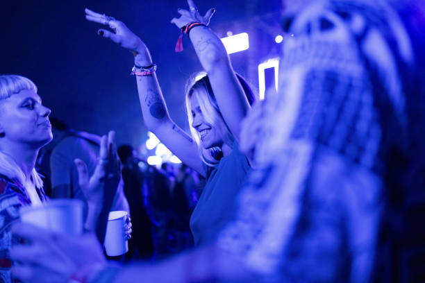 dancing on music festival by night! - concert stock pictures, royalty-free photos & images