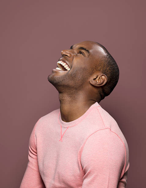 dark skinned looking up, laughing - hairstyle stock pictures, royalty-free photos & images