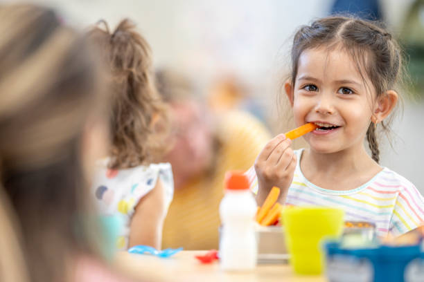 daycare children eating lunch - food stock pictures, royalty-free photos & images
