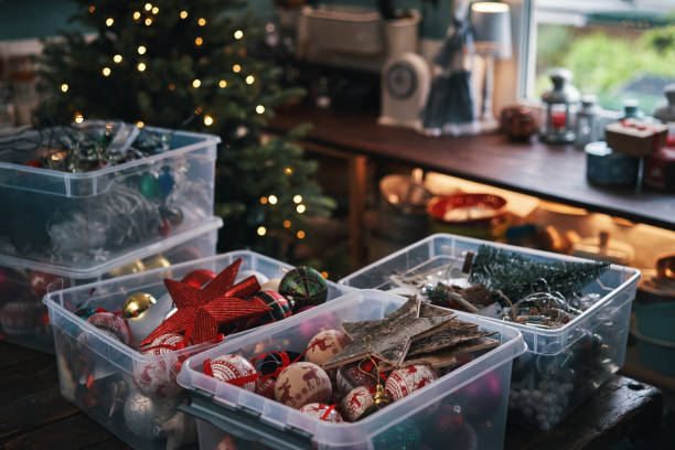 decorating christmas tree with ornaments and christmas lights - home decoration stock pictures, royalty-free photos & images