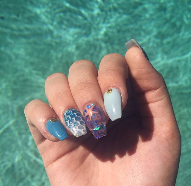 decorative nail art on fingernails - nails art stock pictures, royalty-free photos & images
