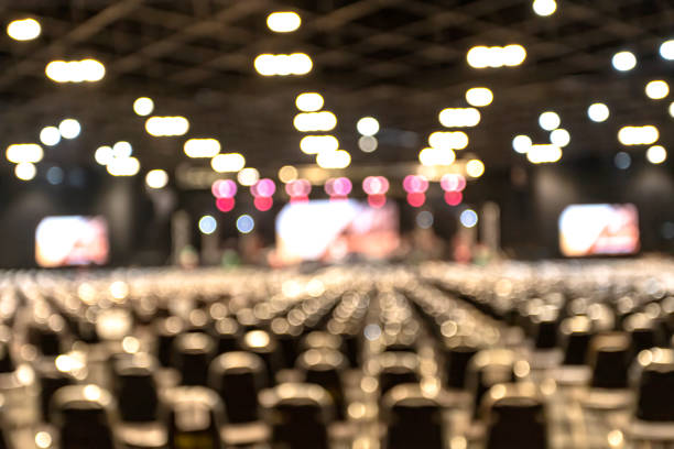 defocused illuminated lights at concert - concert stock pictures, royalty-free photos & images