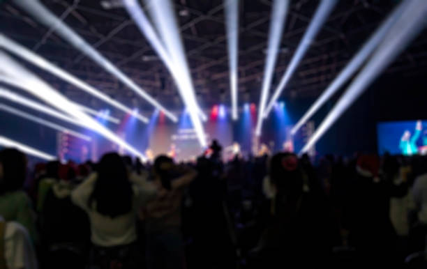 defocused illuminated lights at stage a music concert - concert stock pictures, royalty-free photos & images