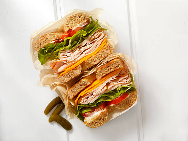 deli style turkey bagel sandwich - junk food stock pictures, royalty-free photos & images