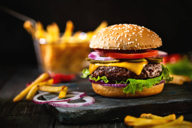 delicious homemade hamburger and french fries - junk food stock pictures, royalty-free photos & images