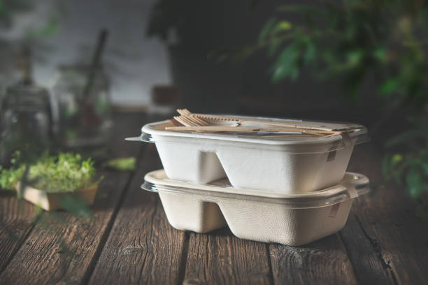 delivered food in eco friendly paper packaging boxes on wooden table . - junk food stock pictures, royalty-free photos & images