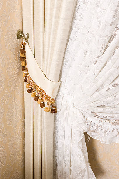 detail of curtains drawn back - home decoration stock pictures, royalty-free photos & images