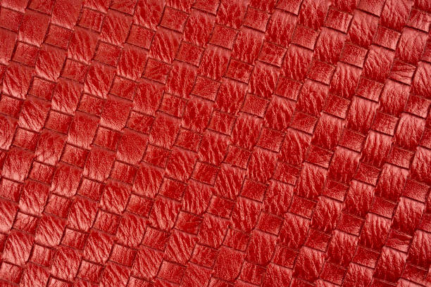 detail of woven red color leather a textured background. - home decoration stock-fotos und bilder