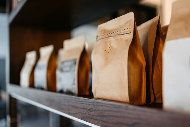 different types of coffee sorted out in paper bags in a coffee shop in kuwait - coffee stockfoto's en -beelden