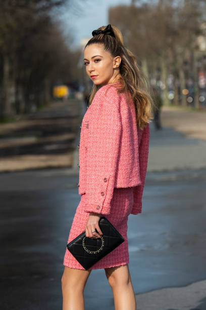 Digital influencer Lyna Zerrouki wears all Chanel with a black bow in her hair on March 03, 2020 in Paris, France.