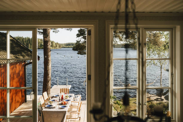 dining table seen through window on sunny day - garden decoration photos et images de collection