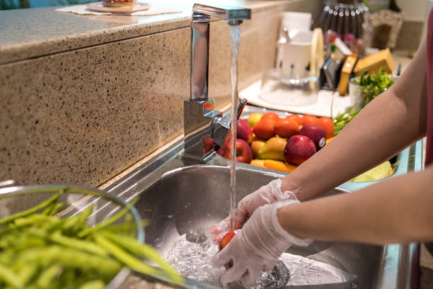 disinfecting groceries during covid-19 - food stock pictures, royalty-free photos & images