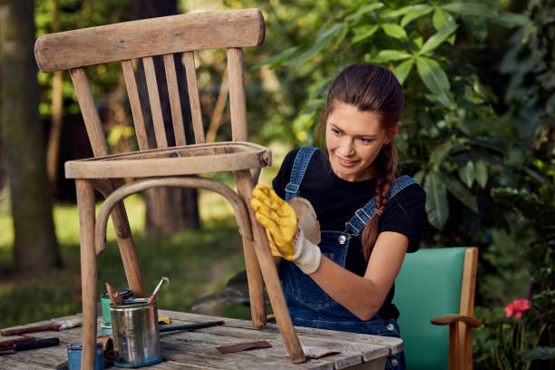 diy in the garden. grinding wooden chair - garden decoration stock pictures, royalty-free photos & images