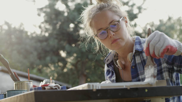 diy in the garden. renovating old wooden furniture - garden decoration stock pictures, royalty-free photos & images