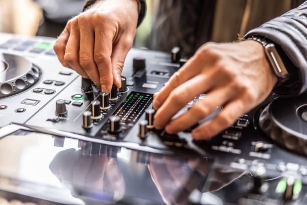 dj hands mixing music for a night club party or wedding. - concert stock pictures, royalty-free photos & images
