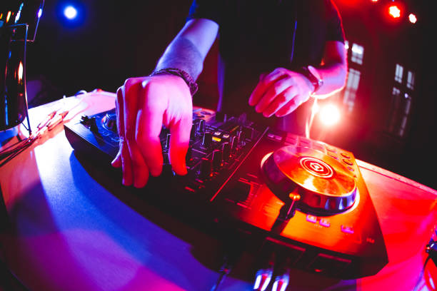 dj playing and mixing music at party - concert stock pictures, royalty-free photos & images