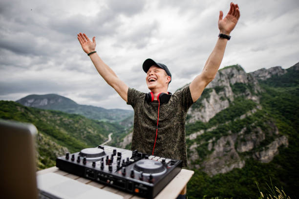 dj playing music in nature - concert stock pictures, royalty-free photos & images