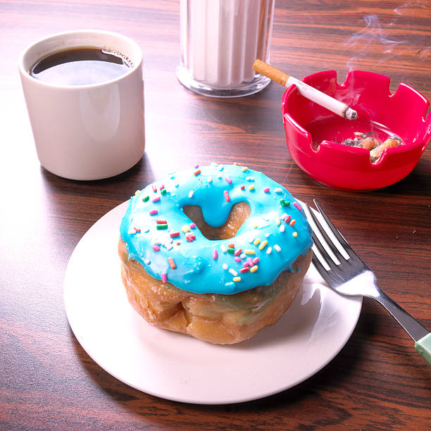 donut and smoking - junk food stock pictures, royalty-free photos & images