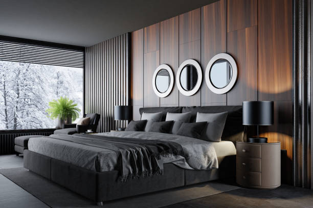 dormitorio moderno de estilo hotel de lujo con materiales oscuros y paneles de madera y suelo de piedra oscura - home decoration fotografías e imágenes de stock