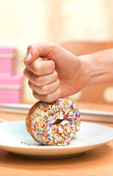 doughnut just say no - junk food stock pictures, royalty-free photos & images