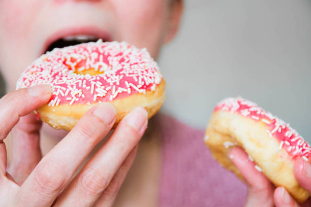 doughnuts - junk food stock pictures, royalty-free photos & images