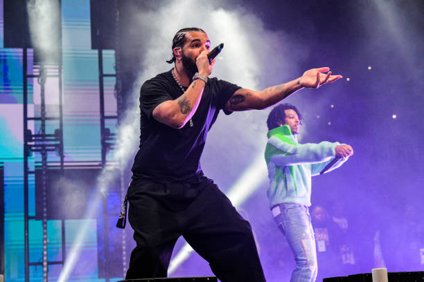 Drake and 21 Savage perform onstage during "Lil Baby & Friends Birthday Celebration Concert" at State Farm Arena on December 9, 2022 in Atlanta,...
