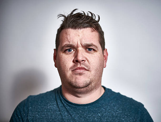 early 30's male with a displeased expression - hairstyle stock pictures, royalty-free photos & images
