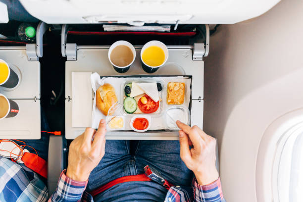 eating airplane food during a flight, personal perspective directly above view - food stock pictures, royalty-free photos & images